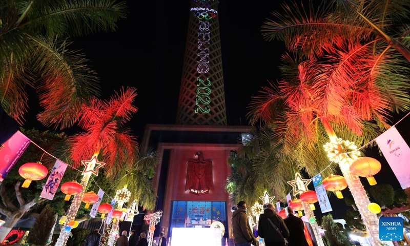 Photo taken on Jan. 24, 2022 shows the Cairo Tower during a light show in Cairo, Egypt. A light show was held at the Cairo Tower for the upcoming Beijing 2022 Winter Olympics.(Photo: Xinhua)