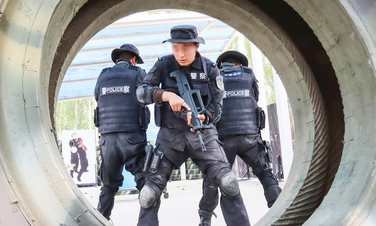 Kuqa Public Security Bureau officers simulate combat scenarios during a special counter-terrorism training session on July 15, 2021. Photo: Courtesy of Liao Linbo