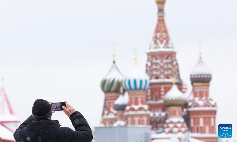 A man takes a photo in the Red Square in Moscow, Russia, on Jan. 26, 2022.Photo:Xinhua