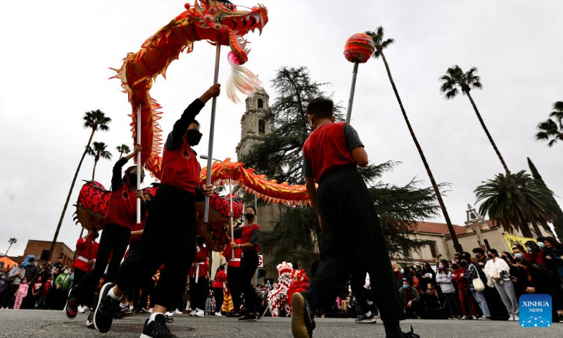 People perform a dragon dance during the Riverside Lunar Festival celebrations in Riverside County, California, the United States, on Jan. 29, 2022. (Xinhua)