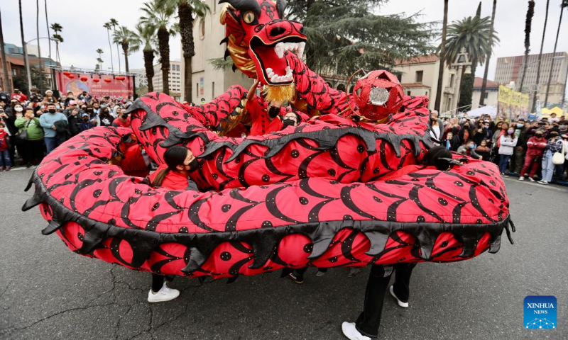 People perform a dragon dance during the Riverside Lunar Festival celebrations in Riverside County, California, the United States, on Jan. 29, 2022. (Xinhua)