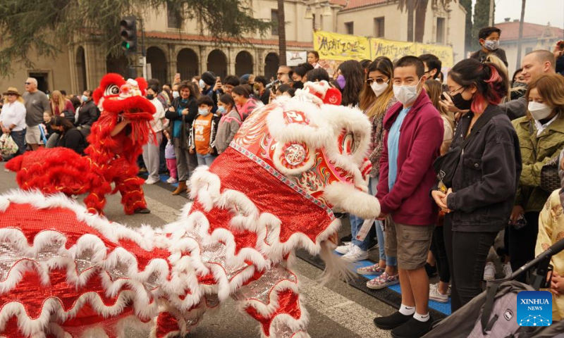 People perform a lion dance during the Riverside Lunar Festival celebrations in Riverside County, California, the United States, on Jan. 29, 2022. (Xinhua)
