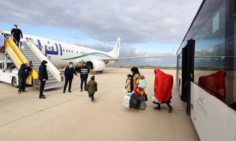 Illegal immigrants are seen boarding an airplane at the Misurata International Airport in Misurata, Libya, Jan. 27, 2022.(Photo: Xinhua)