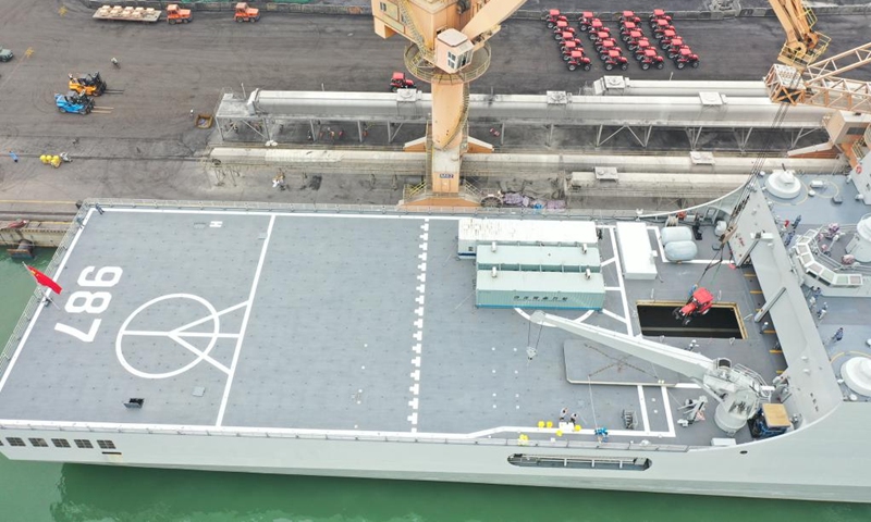 Aerial photo taken on Jan. 28, 2022 shows relief supplies being transferred onto a ship waiting to depart for Tonga, in Guangzhou, south China's Guangdong Province. (Photo by Yin Zheng/Xinhua)