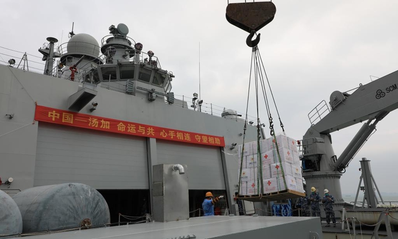 Relief supplies are transferred onto a ship waiting to depart for Tonga, in Guangzhou, south China's Guangdong Province, Jan. 29, 2022. (Photo by Xue Chengqing/Xinhua)