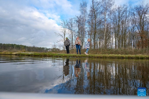 People visit the wetlands at De Wijers nature reserve in Limburg Province, Belgium, Jan. 6, 2022. World Wetlands Day, celebrated annually on Feb. 2, aims to raise global awareness about the vital role of wetlands. (Xinhua/Zhang Cheng)



