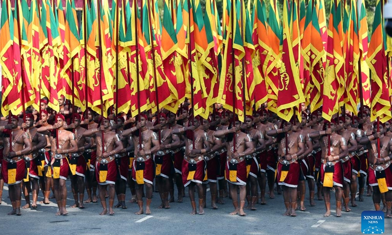 People take part in a parade during the Independence Day celebrations in Colombo, Sri Lanka, on Feb. 4, 2022.Photo:Xinhua
