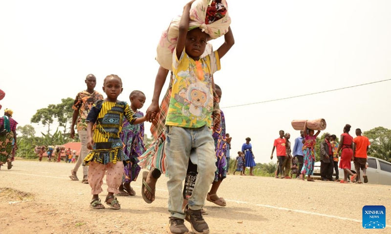Congolese refugees cross the Busungu border post, Bundibugyo District, Western Region of Uganda, Feb. 3, 2022.Photo:Xinhua