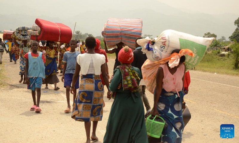 Congolese refugees cross the Busungu border post, Bundibugyo District, Western Region of Uganda, Feb. 3, 2022.Photo:Xinhua