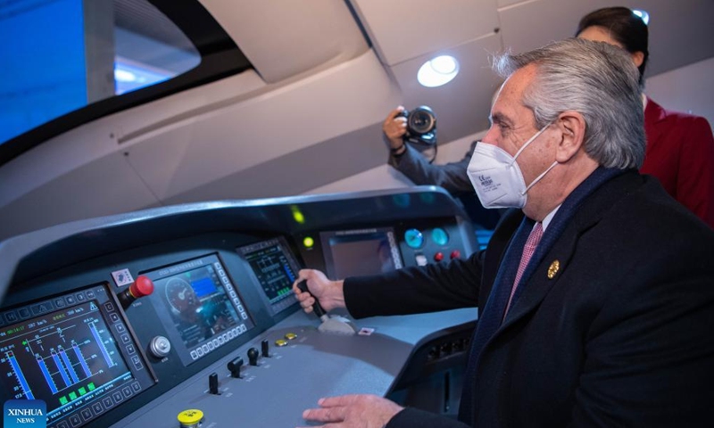 Argentine President Alberto Fernandez experiences simulated driving of high-speed railway train at the Museum of the Communist Party of China in Beijing, China, Feb. 4, 2022.Photo:Xinhua