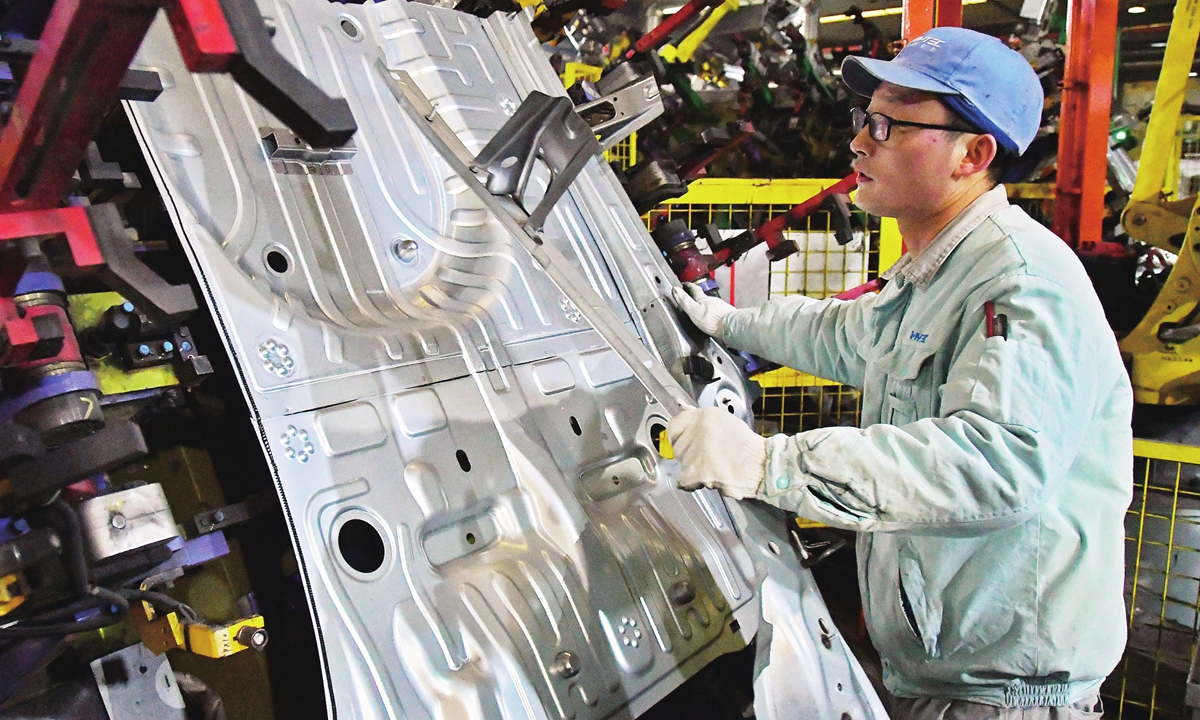 A worker in an auto component company in Yantai, East China's Shandong Province on February 7, 2022. Enterprises across the country restarted production as the week-long Spring Festival holidays finished. Photo: cnsphoto