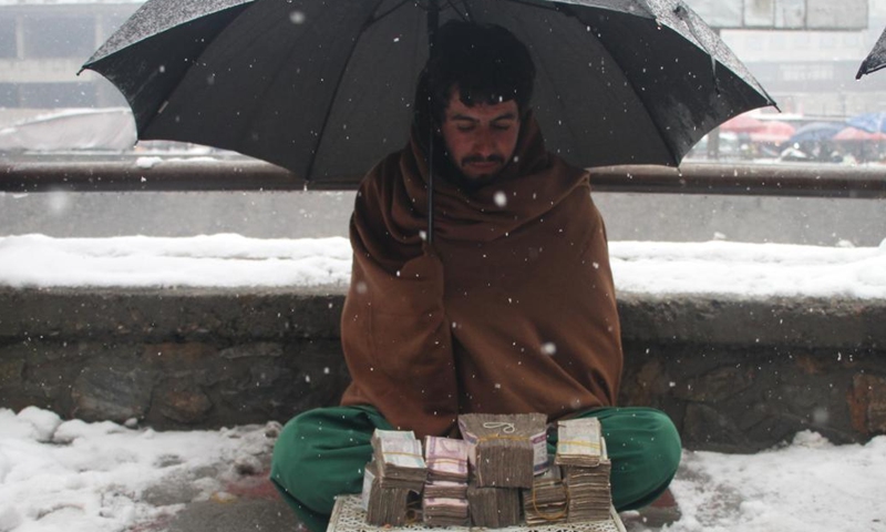 An Afghan currency exchange dealer waits for customers in Kabul, Afghanistan, Feb. 6, 2022.Photo:Xinhua