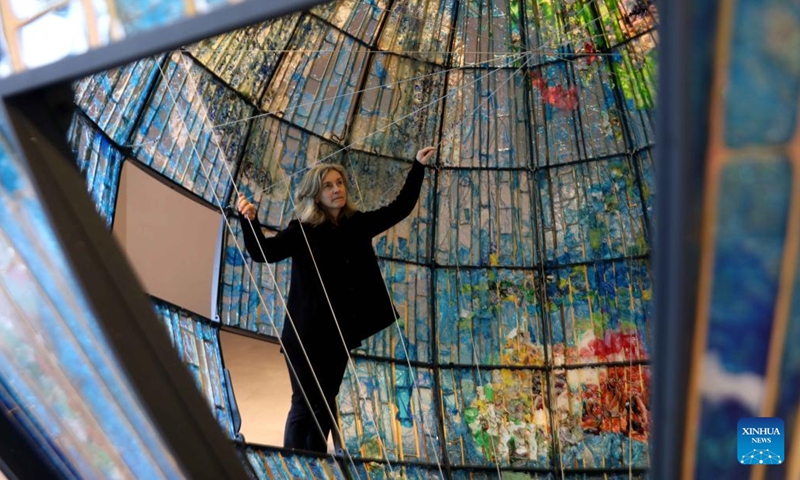 Israeli artist Beverly Barkat shows her exhibition Earth Poetica in the aquarium at Jerusalem's Biblical Zoo on Feb. 6, 2022.Photo;Xinhua