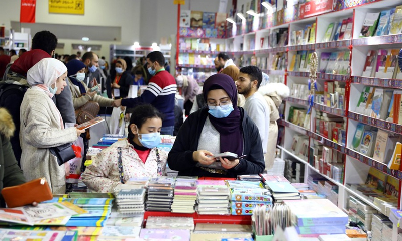 People visit the pavilion for translated Chinese books at the 53rd Cairo International Book Fair in Cairo, Egypt, on Feb. 4, 2022. (Photo: Xinhua)