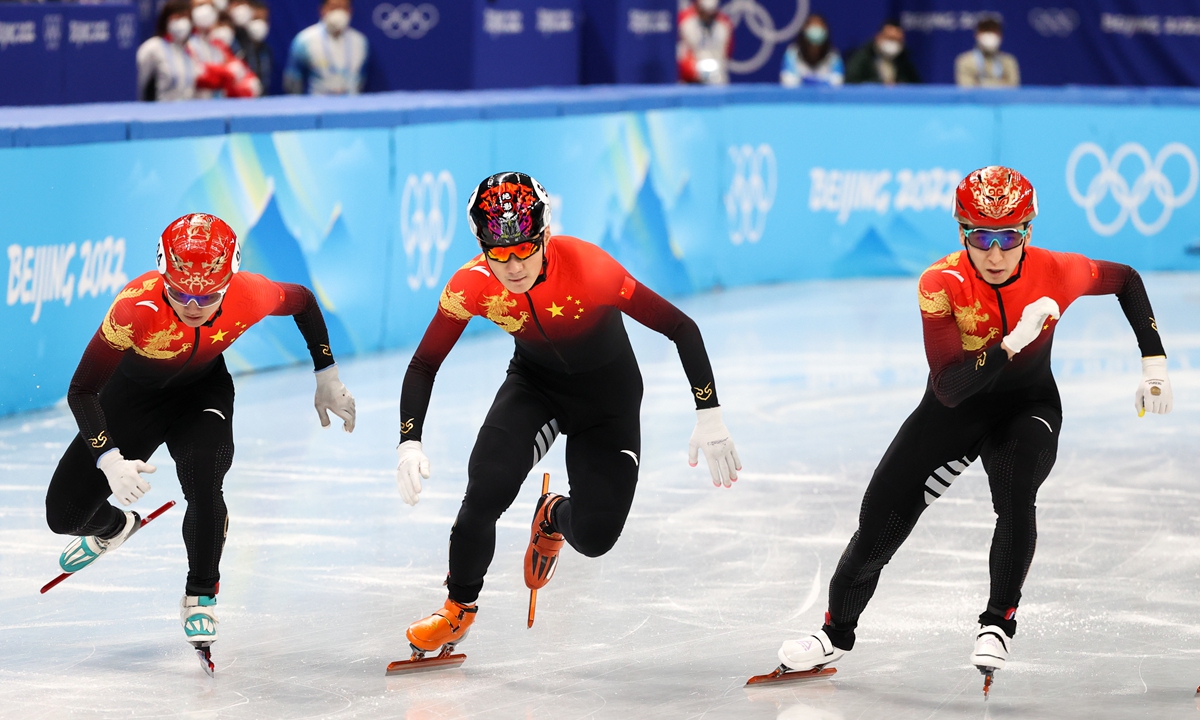 Chinese athletes Wu Dajing, Ren Ziwei and Li Wenlong (L-R) of China compete in a men's final 1,000m short track speed skating race at the Capital Indoor Stadium as part of the 2022 Winter Olympic Games.Photo:IC