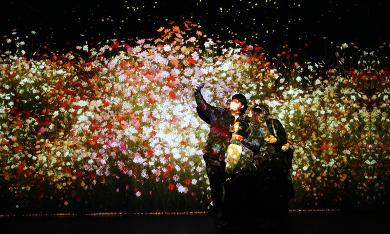 People take a selfie when visiting an immersive multimedia art exhibition at Arte Museum in Gangneung, South Korea, Feb. 6, 2022. (Photo: Xinhua)