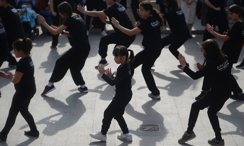 Students from the Malta School of Wushu-Longgui perform Chinese martial arts in the Garden of Serenity, a traditional Chinese garden, in Santa Lucija, Malta, on Feb. 6, 2022.(Photo: Xinhua)