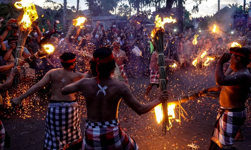 People participate in a fire war ceremony, locally called Siat Geni, at Duda Village in Bali, Indonesia, Jan. 31, 2022.Photo:Xinhua