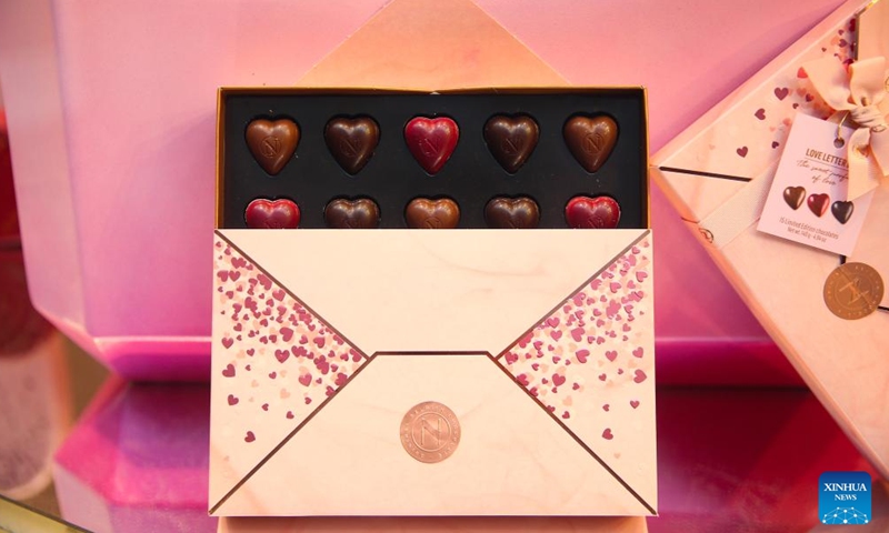 Chocolates in the theme of Valentine's Day are seen at a shop in Brussels, Belgium, Feb. 8, 2022. As the Valentine's Day approaches, new products by Belgian chocolate manufacturers have been put into market to attract shoppers.Photo:Xinhua