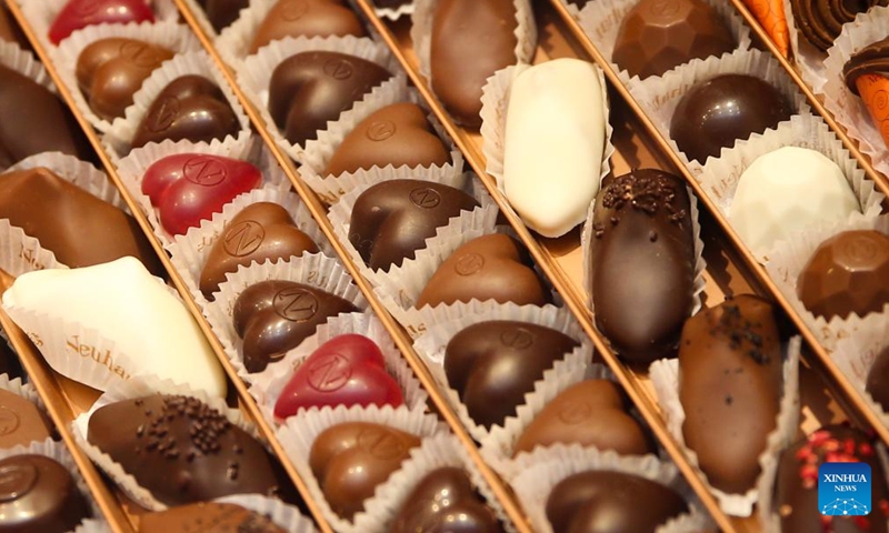 Chocolates in the theme of Valentine's Day are seen at a shop in Brussels, Belgium, Feb. 8, 2022. As the Valentine's Day approaches, new products by Belgian chocolate manufacturers have been put into market to attract shoppers.Photo:Xinhua