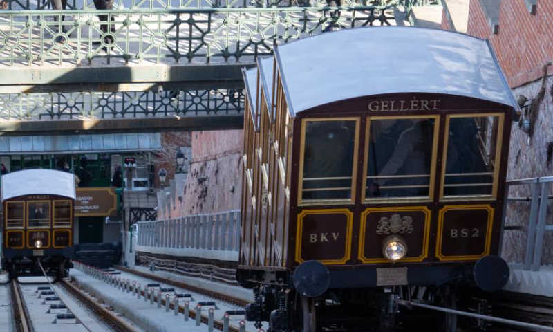 The 152-year-old Buda Castle Hill Funicular is seen as it restarts after a renovation in Budapest, Hungary on Feb. 8, 2022. The Buda Castle Hill Funicular, starting on March 2, 1870, is a tourist attraction of Budapest. After a big renovation, it reopened on Feb. 8. (Photo by Attila Volgyi/Xinhua)