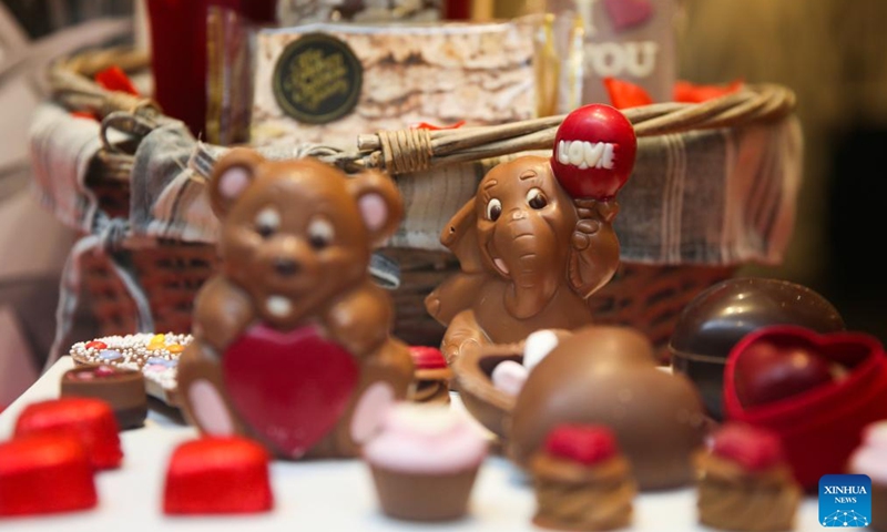 Chocolates in the theme of Valentine's Day are seen at a shop in Brussels, Belgium, Feb. 8, 2022. As the Valentine's Day approaches, new products by Belgian chocolate manufacturers have been put into market to attract shoppers.Photo:Xinhua