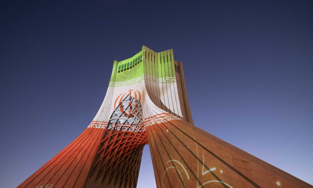 An Iran flag is pictured on the Azadi (Freedom) Monument in western Tehran on February 7, 2022. Photos: VCG