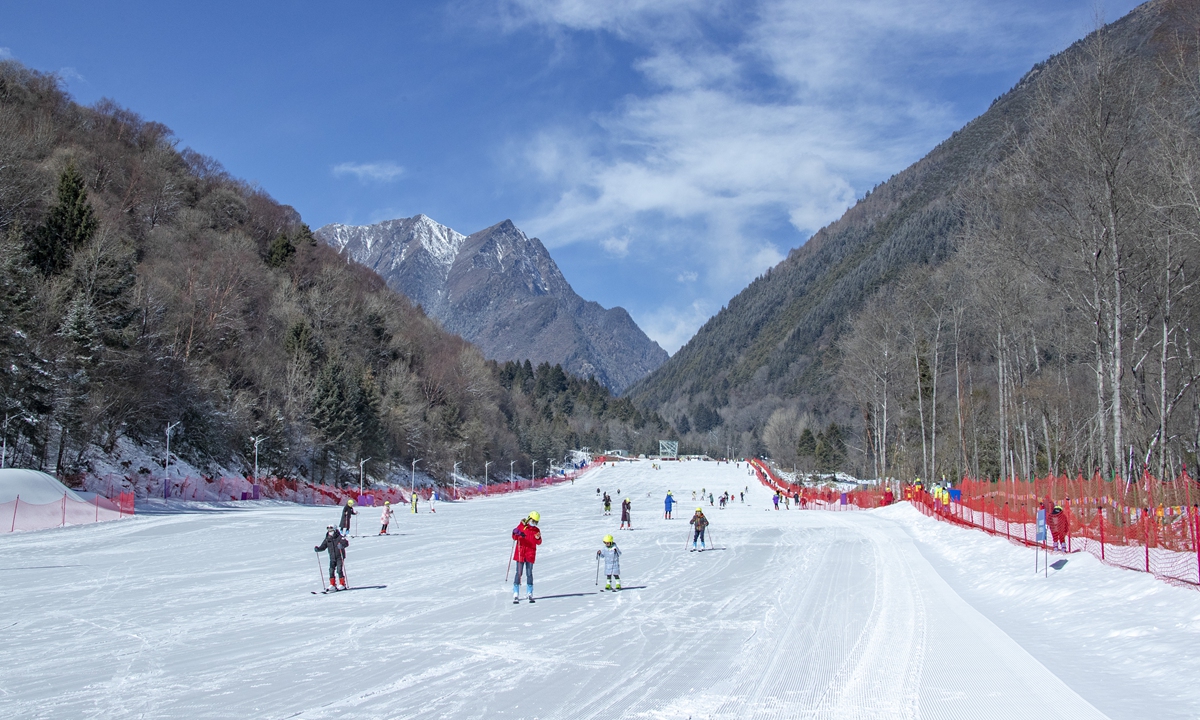 Tourists ski at the Mengtunhegu ski resort at the Aba Tibetan and Qiang Autonomous Prefecture in Southwest China's Sichuan Province on February 9, 2022. Photo: VCG