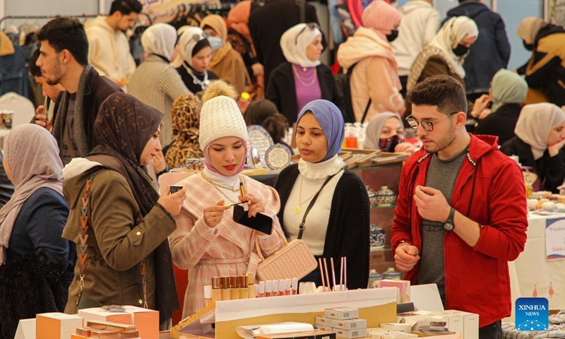 People visit an exhibition held to support small business owners at a hotel in Gaza City, on Feb. 9, 2022.(Photo: Xinhua)