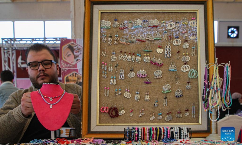 A Palestinian man participates in an exhibition held to support small business owners at a hotel in Gaza City, on Feb. 9, 2022.(Photo: Xinhua)