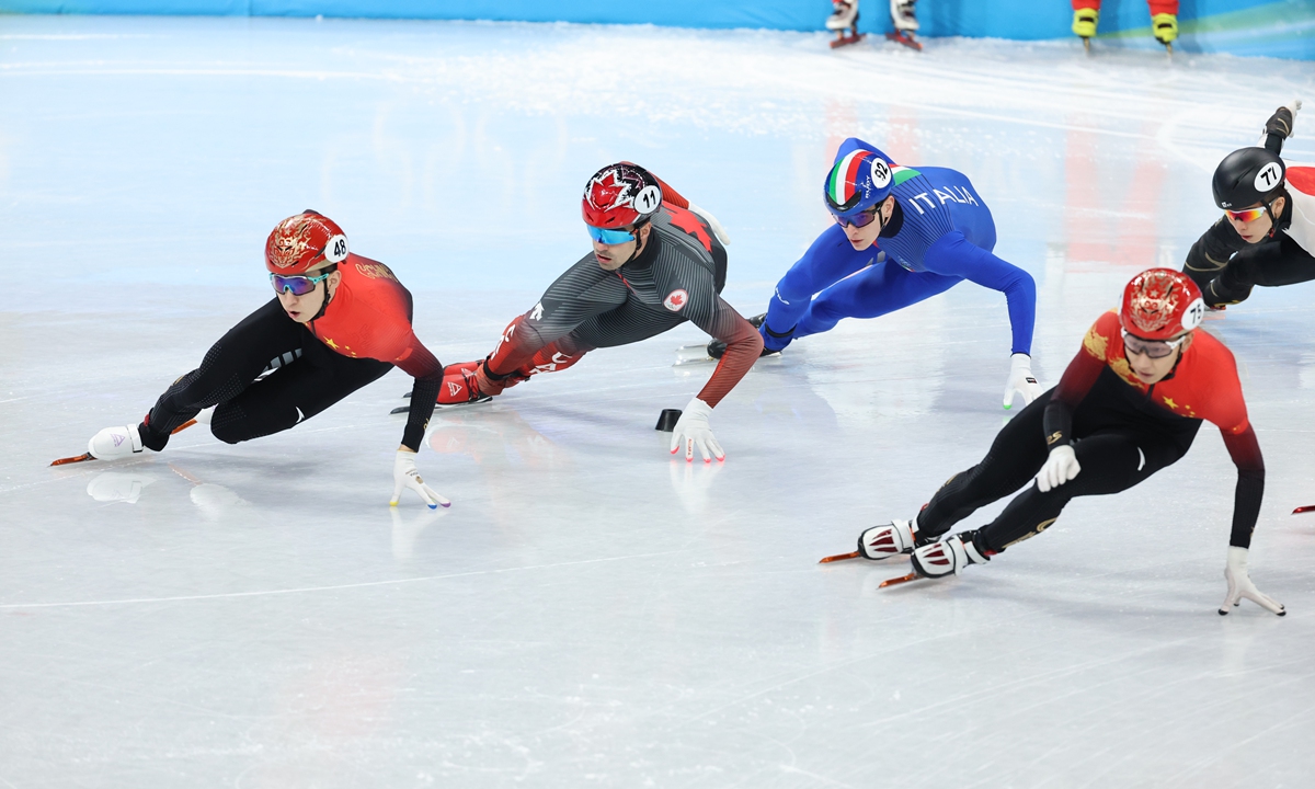 Chinese short track speed skaters Wu Dajing (No.48) and Sun Long (No.75) compete in the men's 5,000 meters relay semifinal on February 11. Photo: Li Hao/Global Times