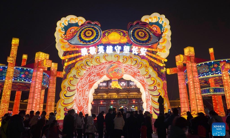 People view lanterns ahead of the Lantern Festival at the Tang Paradise in Xi'an, northwest China's Shaanxi Province, Feb. 10, 2022. Lanterns are lit up to celebrate the Lantern Festival in Xi'an.(Photo: Xinhua)