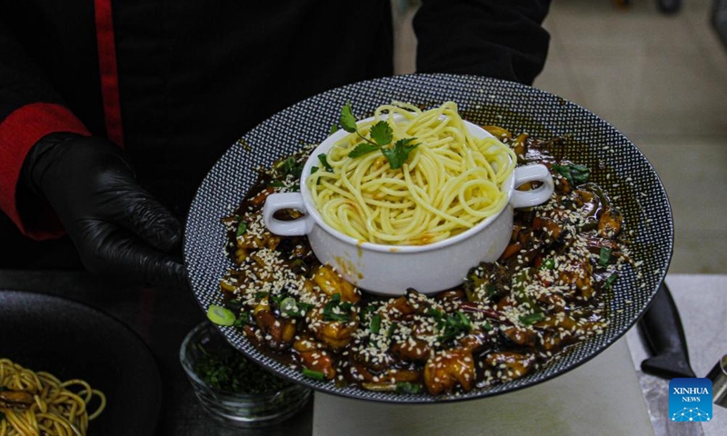 Ibrahim Badwan, a chef, prepares Chinese dishes at Mzaaq center for culinary arts education, in Gaza City, Feb. 6, 2022.Photo:Xinhua