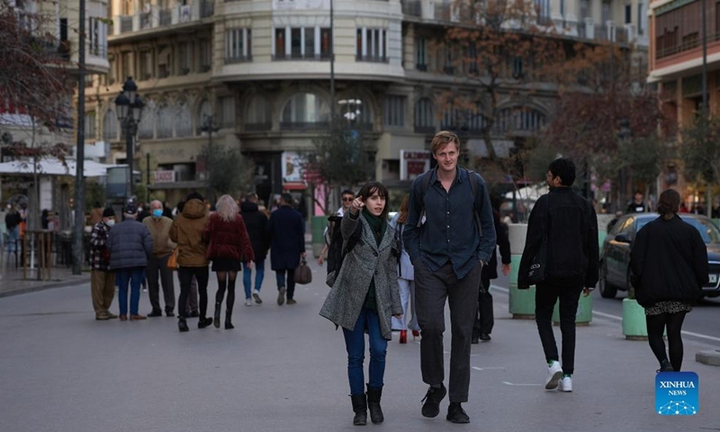 People walk in downtown Valencia, Spain, on Feb. 11, 2022.Photo:Xinhua