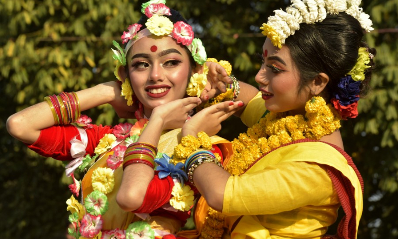 Artists pose for photos on the sidelines of a program marking Pohela Falgun, the first day of spring and of the Bengali month Falgun, along with the Valentine's Day in Dhaka, Bangladesh on Feb. 14, 2022. (Photo: Xinhua)