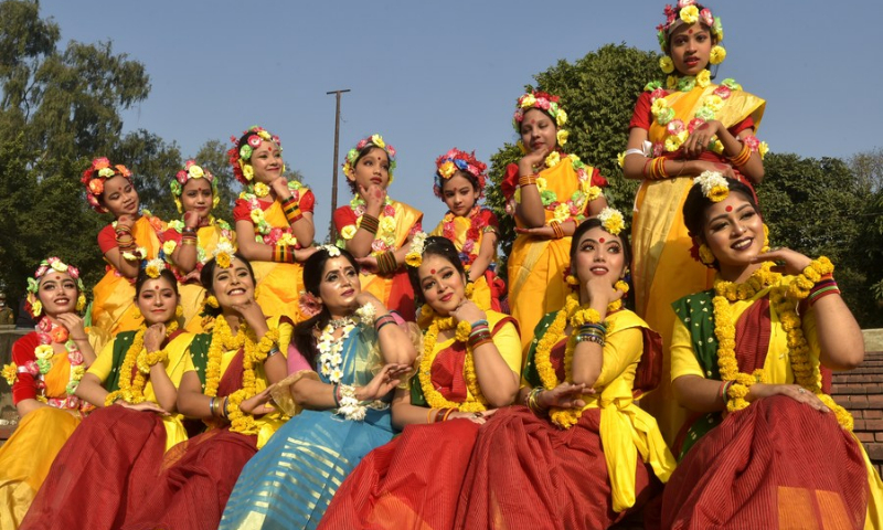Artists pose for photos on the sidelines of a program marking Pohela Falgun, the first day of spring and of the Bengali month Falgun, along with the Valentine's Day in Dhaka, Bangladesh on Feb. 14, 2022.(Photo: Xinhua)