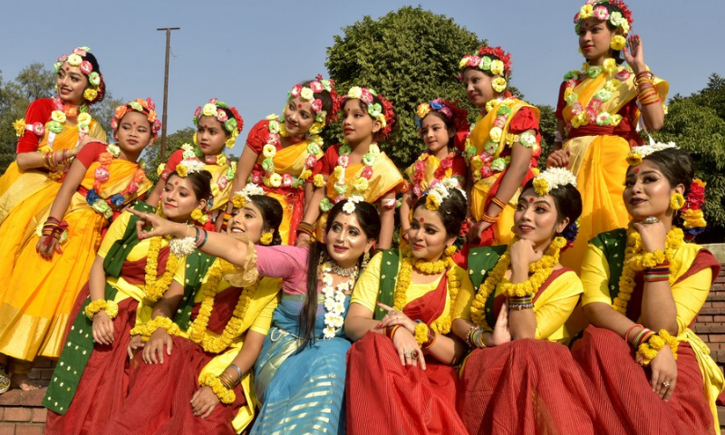Artists pose for photos on the sidelines of a program marking Pohela Falgun, the first day of spring and of the Bengali month Falgun, along with the Valentine's Day in Dhaka, Bangladesh on Feb. 14, 2022. (Photo: Xinhua)
