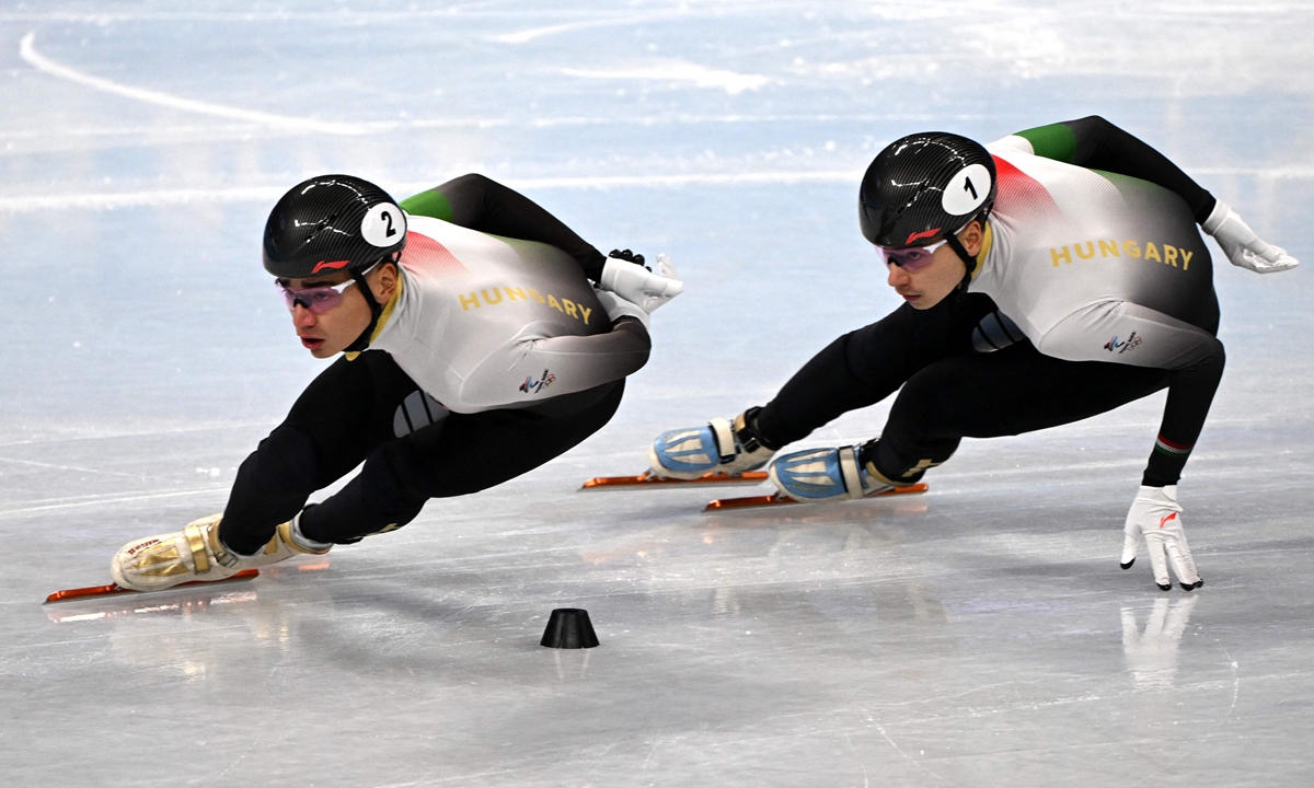Hungary's Liu Shaolin (No.2) competes ahead of his brother Liu Shaoang in the semifinal of the men's 1,000 meters short-track speed skating event in Beijing on February 7, 2022.  Photo:VCG