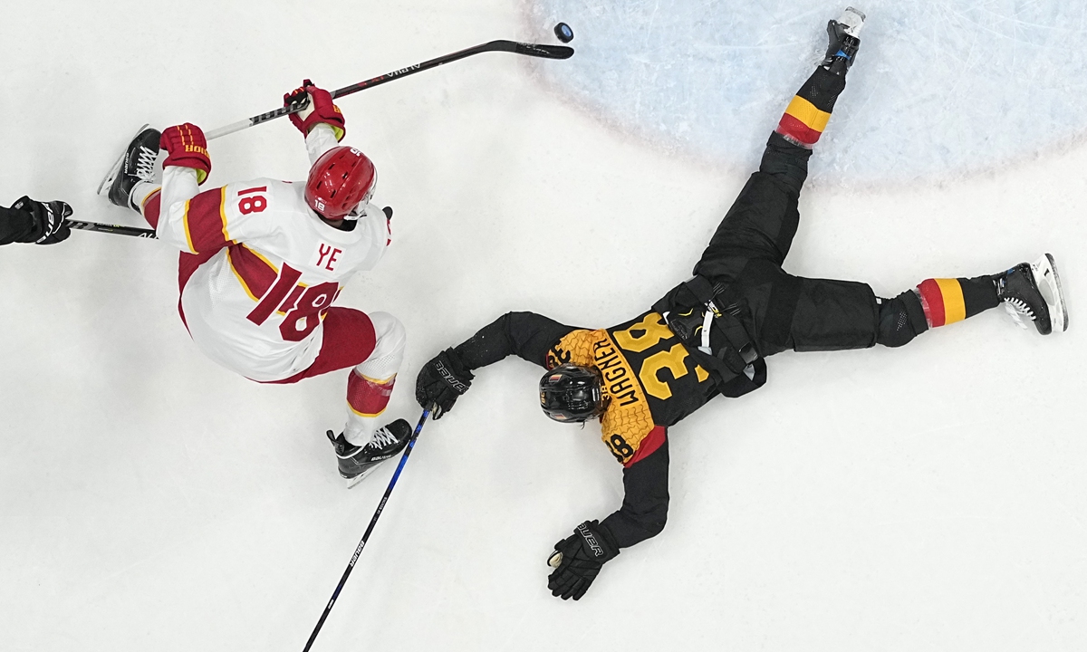 China's Ye Jinguang takes a shot during a preliminary round men's hockey game at the Beijing Winter Olympics on February 12, 2022. Photo: VCG