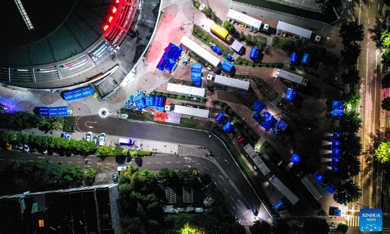 Aerial photo taken on Feb. 13, 2022 shows mobile cabin PCR (polymerase chain reaction) laboratories in Debao County of Baise, south China's Guangxi Zhuang Autonomous Region. In recent days, mobile laboratories and air-inflated laboratories have been put into use in order to improve the efficiency of COVID-19 nucleic acid testing in Debao County.(Photo: Xinhua)