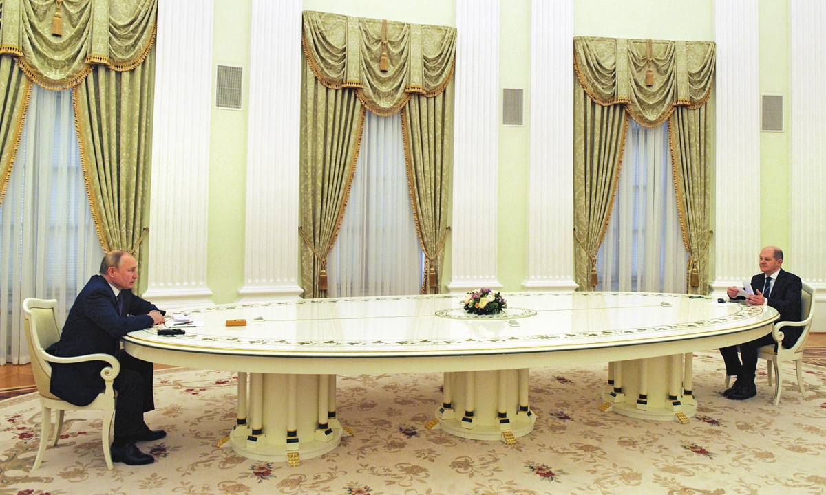 Russian President Vladimir Putin (left) and German Chancellor Olaf Scholz meet on Ukraine at the Kremlin, in Moscow, on February 15, 2022. The Kremlin earlier confirmed a pullback of some Russian forces from Ukraine's borders but said the move was planned and stressed Russia would continue to move troops across the country as it saw fit. Photo: AFP