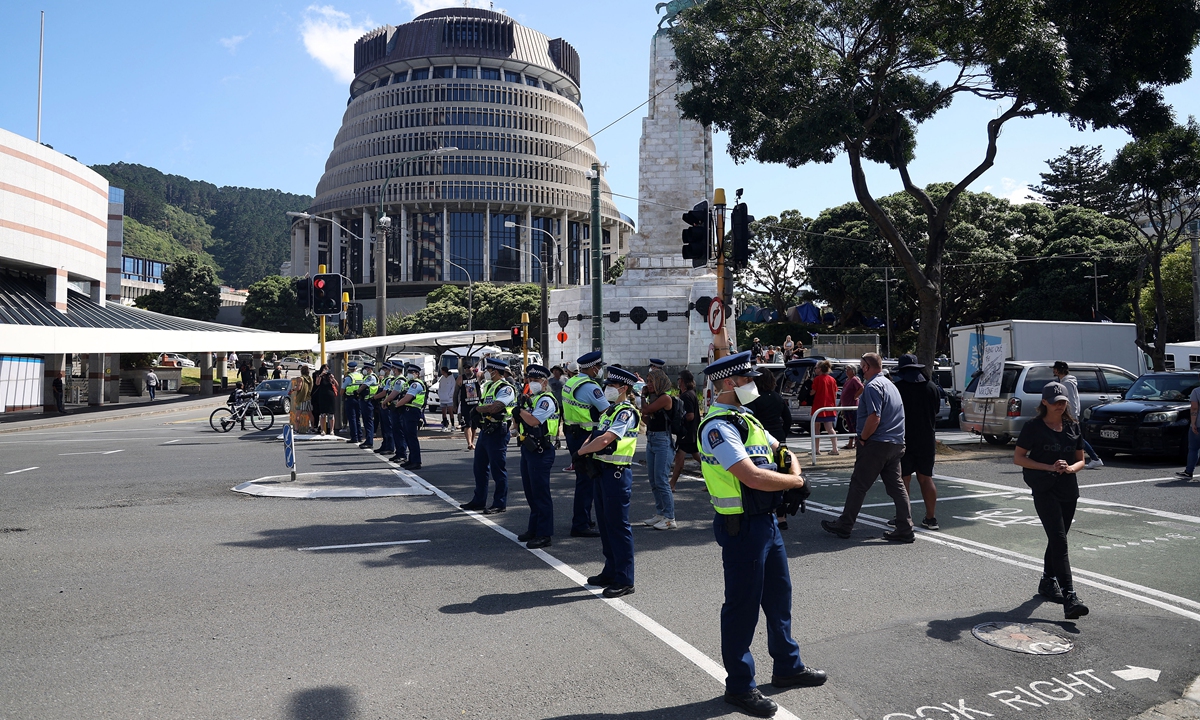 Police take over an intersection leading to Parliament on the ninth day of protests against COVID-19 restrictions in Wellington, New Zealand on February 16, 2022, inspired by a similar demonstration in Canada. Prime Minister Jacinda Ardern has referred to the protests as an 