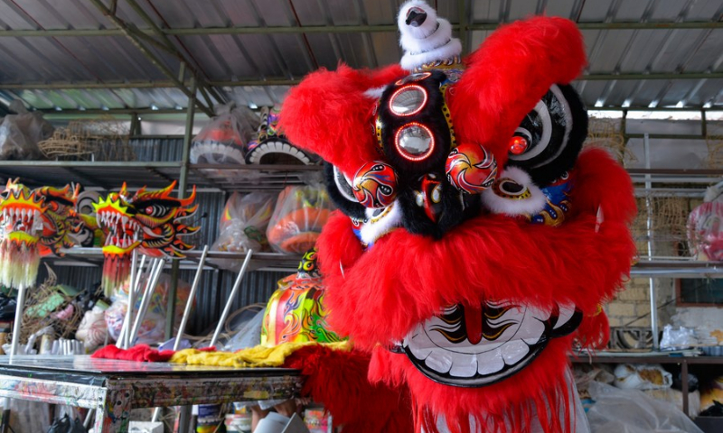 Lily Hambali shows lion dance at his workshop in Bogor, Indonesia on Feb. 14, 2022. (Photo: Xinhua)