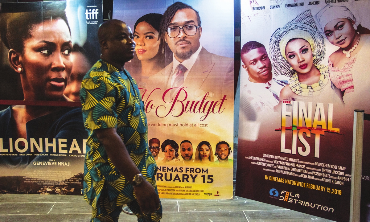 A man passes by Nigerian movie billboards at a cinema in Lagos, Nigeria on February 19, 2019. File photo: AFP