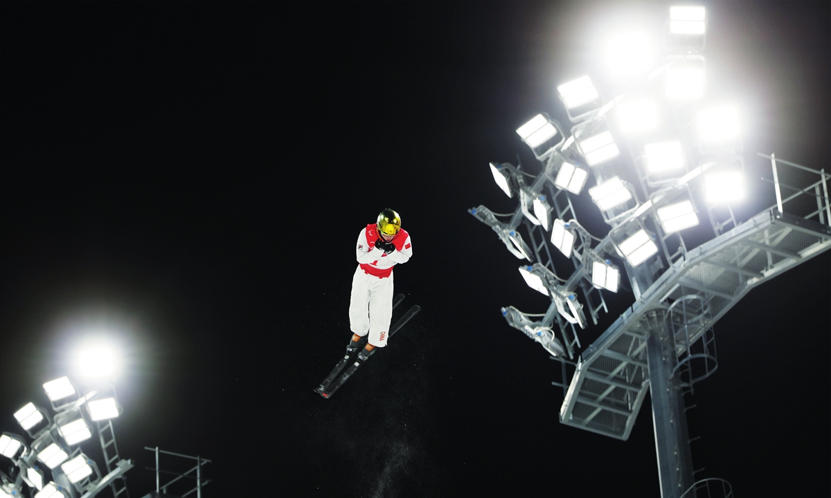 Qi Guangpu of China competes during the freestyle skiing men's aerials final of Beijing 2022 Winter Olympics at Genting Snow Park in Zhangjiakou, north China's Hebei Province, February 16, 2022. Qi scored 129 points to grab the men's aerials gold in his fourth Olympic appearance. Photo: Cui Meng/GT