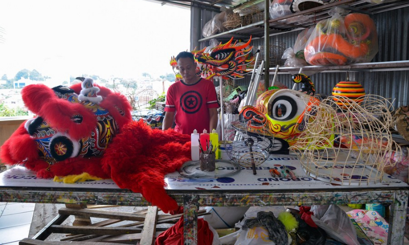 Lily Hambali shows finished and semi-finished products for lion dance at his workshop in Bogor, Indonesia on Feb. 14, 2022. (Photo: Xinhua)
