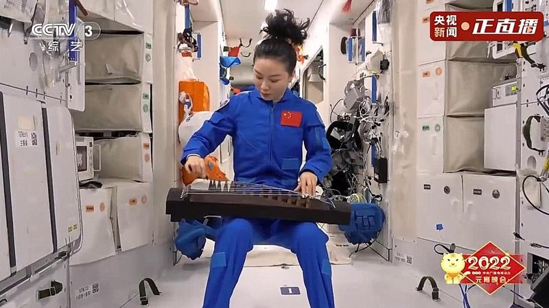 Taikonaut Wang Yaping guzheng onboard China's space station core module to celebrate the Lantern Festival.