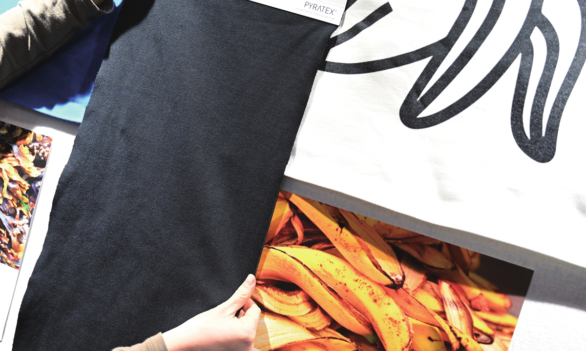 A person shows black fabric made from banana leaves at the Premiere Vision Paris, a fair dedicated to the companies supplying materials and services for the fashion and luxury industries, in Villepinte, north of Paris, on February 10, 2022. Photo: AFP