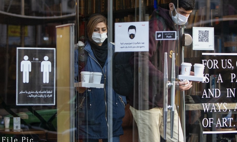 People wearing face masks buy coffee at a cafe in downtown Tehran, Iran, on Jan. 9, 2021. (Photo: Xinhua)