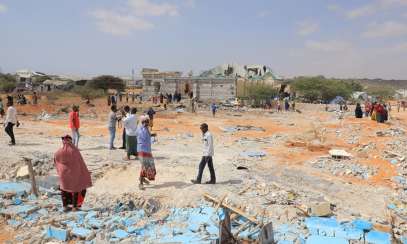 People look at a scene of bomb attacks in Mogadishu, capital of Somalia, Feb. 16, 2022.(Photo: Xinhua)